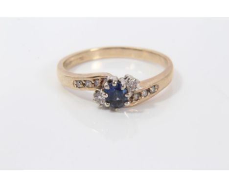 Gold (9ct) sapphire and diamond crossover ring.  Size R CONDITION REPORT Weight 2.9 grams