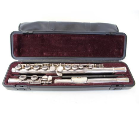 Contemporary Yamaha flute in a fitted case and cover, music stand, Yamaha quartz metronome and a selection of sheet music in 