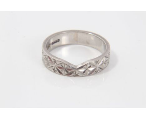 Platinum wedding ring with carved decoration.  Ring size M - N CONDITION REPORT Weight 6.9 grams