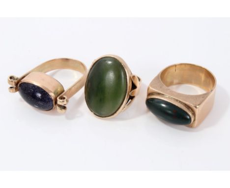 Three yellow metal dress rings set with nephrite jade, bloodstone and gold stone CONDITION REPORT 35.7g total weight. Ring si