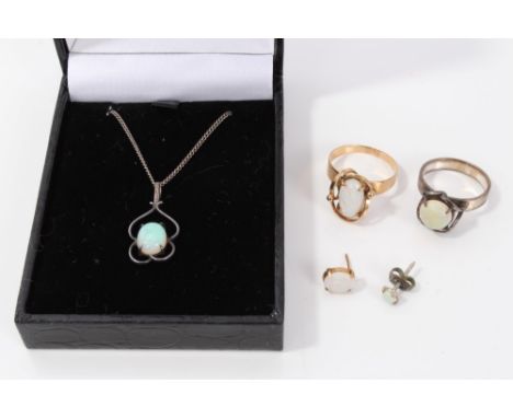 Group of opal jewellery - to include two rings, silver pendant and two earrings CONDITION REPORT Pendant set in silver.  One 