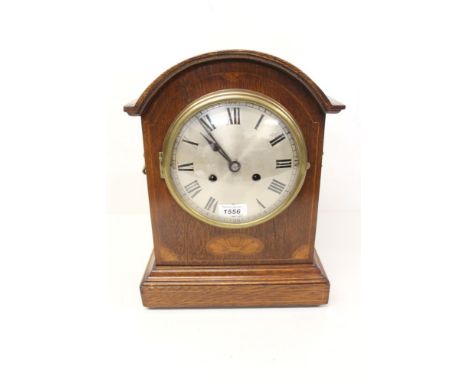 Edwardian bracket clock with a Continental spring-driven movement, striking on a gong and silvered circular dial with Roman n