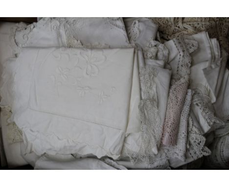 Good quantity of worked table linens - including large tablecloths with crochet lace edging, embroidered cloths, pillow cases