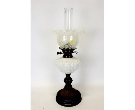 Victorian brass oil lamp with milk glass reservoir and vaseline glass shade, approximately 60cm high