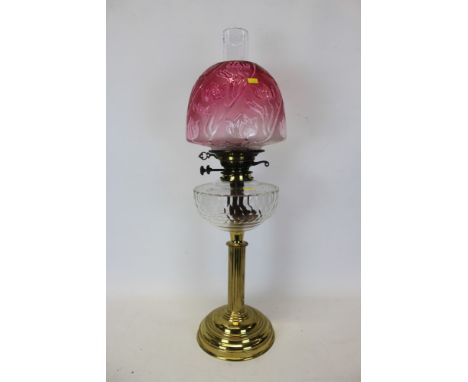 Edwardian duplex brass oil lamp by Palmer &amp; Co., with cut glass reservoir and frosted cranberry glass shade with floral d