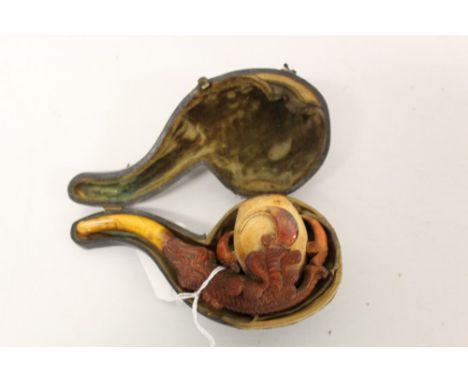 Victorian meerschaum pipe in the form of an eagle's claw, with amber mouthpiece, in original case