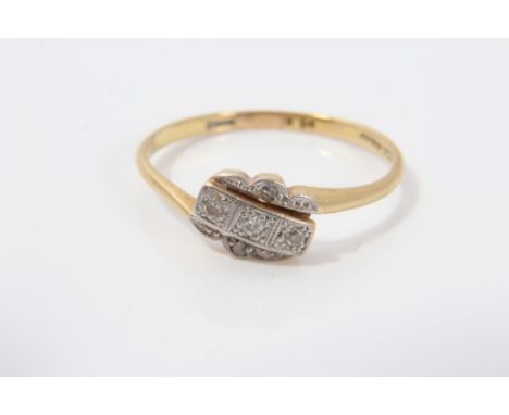 1930s diamond crossover ring in 18ct gold and platinum setting.  Ring size O CONDITION REPORT Good condition, wear commensura