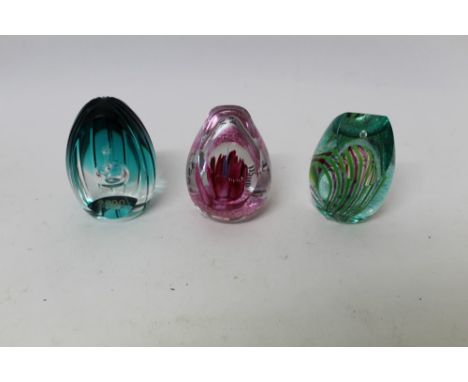 Three Caithness limited edition glass paperweights - Millennium Flame 1999, by Colin Terris, no. 71 of 1000, Fantasy Orchid 1