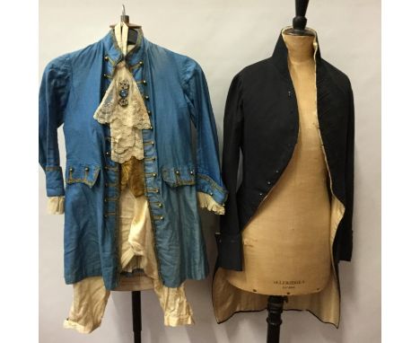 Regency gentlemen's coat, navy possibly cotton moleskin with quilted silk lining, stand-up collar, two exterior pockets with 