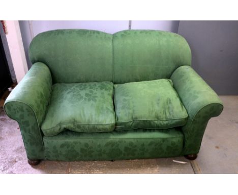 Green upholstered sofa