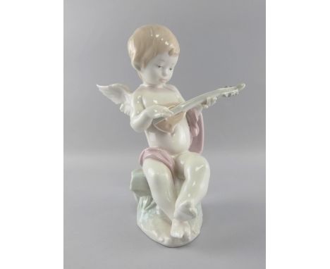 Lladro figure of a cherub playing a guitar