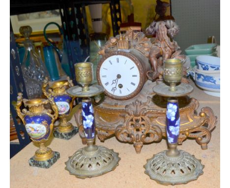 French 19th century gilt metal mantle clock surmounted with a musician playing a violin, a pair of gilt metal and porcelain p