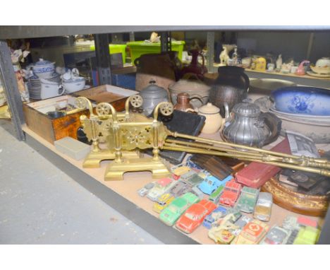 Set of brass fire tools, small collection of toy cars, metal ware teapots and other assorted items.