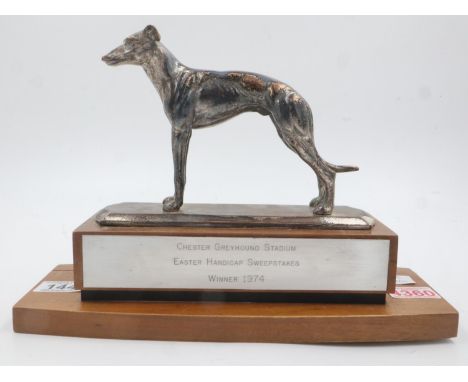 1970s Greyhound Racing trophy, having a silver-plated greyhound on a teak plinth, Chester Greyhound Stadium 1974, H: 22cm. UK