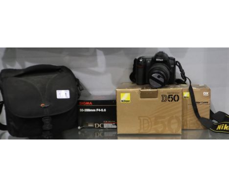 Nikon D50 DSLR camera, Nikkor lens and a further Sigma lens, all boxed. UK P&amp;P Group 2 (£20+VAT for the first lot and £4+