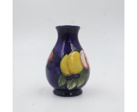 Moorcroft vase in the Wisteria pattern on cobalt blue ground. H: 9.5cm. UK P&amp;P Group 1 (£16+VAT for the first lot and £2+
