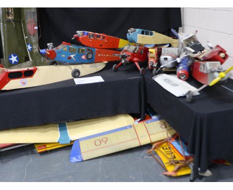 Selection of model aircraft airframes and wings, some fitted with engines including three fourstroke type, also electric moto