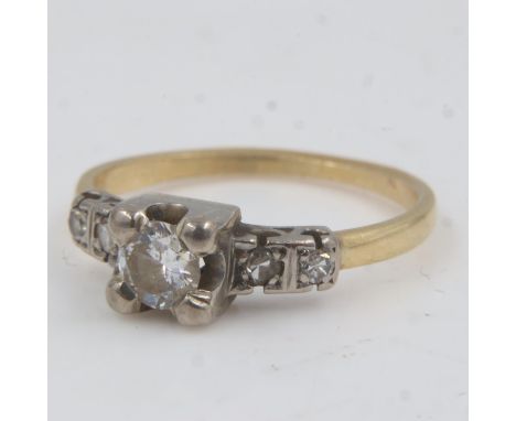 18ct gold diamond set ring, central stone approximately 0.25cts, size M/N, 2.9g. UK P&amp;P Group 0 (£6+VAT for the first lot