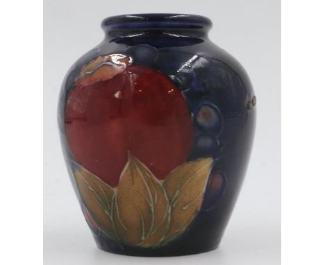 Moorcroft vase in the Pomegranate pattern on cobalt blue ground, H: 8cm. UK P&amp;P Group 1 (£16+VAT for the first lot and £2