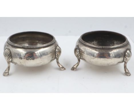 A pair of hallmarked silver tri-footed open salts, combined 98g. UK P&amp;P Group 1 (£16+VAT for the first lot and £2+VAT for