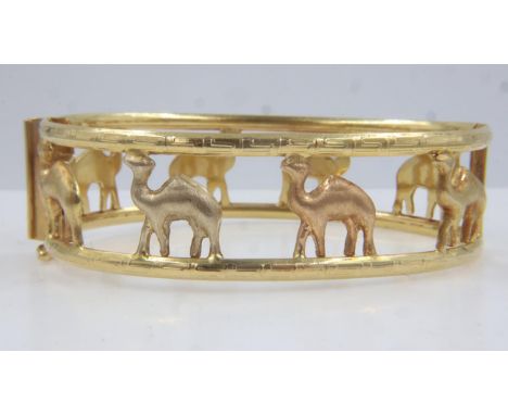 Middle-Eastern 18ct gold hinged bangle by Shazar, pierced with camel design, 70 x 50 mm, 26.3g. UK P&amp;P Group 1 (£16+VAT f