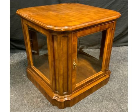 A Heritage reproduction mahogany display unit, shaped square top above a glass panel cupboard door enclosing adjustable shelv