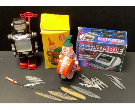 A Japanese Tin plate walking Robot, possibly Horikawa toys;  Grandstand Scramble  game;  Drummer Boy;  cast metal model ships