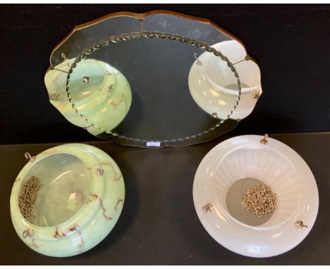 A mid 20th century floral wall mirror, bevelled undulating central panel, 50.5cm diameter;  a marbleized light green and brow