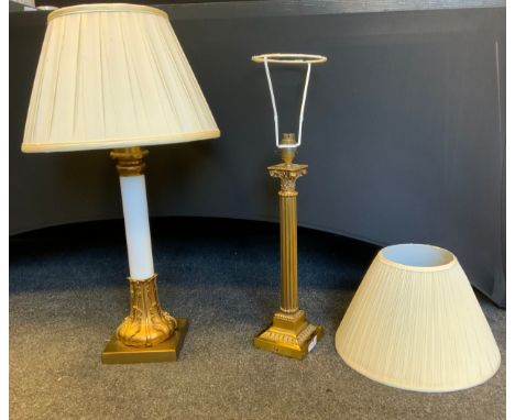 A gilt  metal and white glass side light, cast with stiff leave, 44cm high; a gilt metal corinthian column candlestick, 38.5c