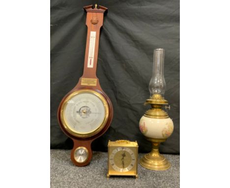 A Russell of Norwich mahogany cased Aneroid Barometer, c.1990; a late 19th/early 20th century brass and ceramic oil lamp; a c
