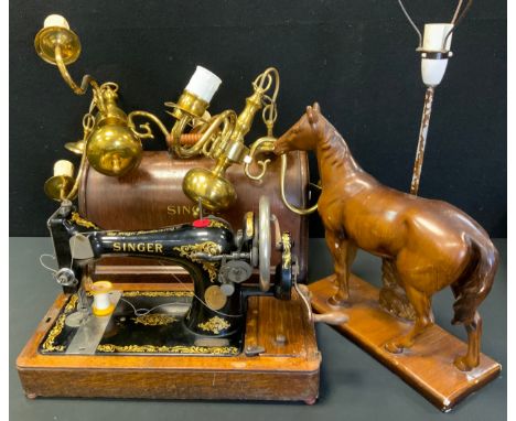 A Singer oak cased hand operated sewing machine, No F3272916;  pair of brass three branch lights;  horse table lamp (4) 