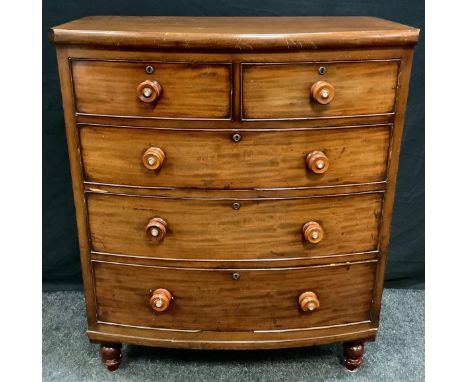 A Victorian mahogany chest of drawers, bow-front top above two short and three long graduated drawers, turned legs, 116cm hig