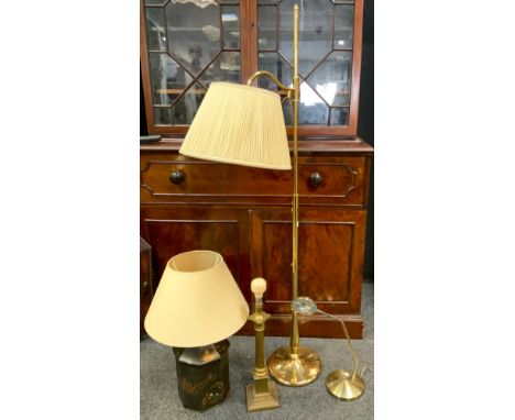 A 20th century adjustable brass floor-standing corner lamp; a chinoiserie table lamp; a brass columnar table lamp; an adjusta