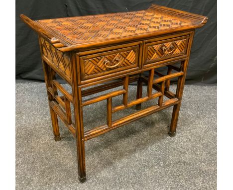 A Reproduction Oriental Style walnut Hall table, carved sleigh-form top above a pair of short drawers, 72cm tall x 77cm x 40c