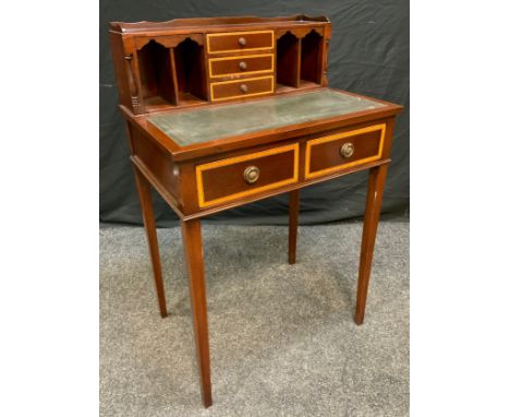 A 20th century George III style reproduction mahogany Bonheur du Jour, having three small drawers, flanked by two pairs of pi