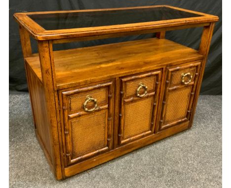 A Contemporary 'Drexel' style, walnut side table/cabinet, rounded rectangular oversailing top with glazed central panel, abov