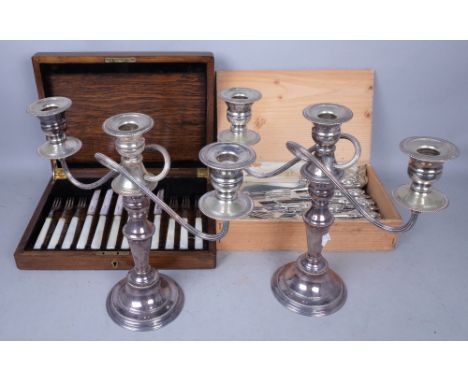 SILVER PLATE COMPRISING; A PAIR OF THREE BRANCH CANDELABRA AND TWO CASED SETS OF FLATWARE (4)