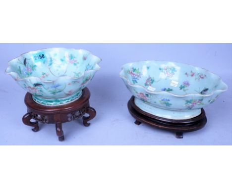 ASIAN CERAMICS; TWO EARLY 20TH CENTURY CHINESE CELADON GLAZED BOWLS ON HARDWOOD STANDS (2)The largest 20cm wide; 17cm highCon