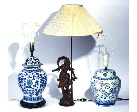 A SPELTER FIGURAL TABLE LAMP (3)Together with two Asian style blue and white table lampsCondition Report: Good overall condit