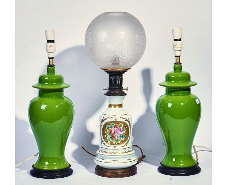 A PAIR OF 20TH CENTURY GREEN GLAZED ASIAN STYLE TABLE LAMPS (3)And a porcelain oil lamp decorated with flowersThe two green l