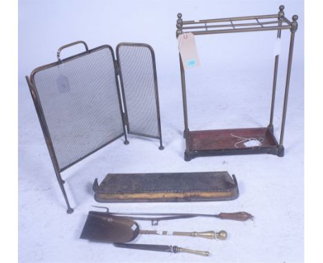 A VICTORIAN EIGHT DIVISION STICKSTAND (7)41cm wide; 58cm high, a early 20th century brass and mesh folding fire screen 38cm w
