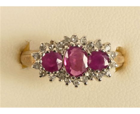 A 9ct gold ruby and diamond triple cluster ring, L 1/2, 3.3gm 