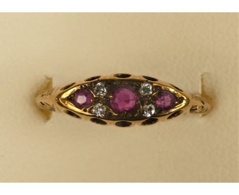 A 9ct ruby and diamond boat shape Edwardian style ring, O 1/2, 1.3gm 