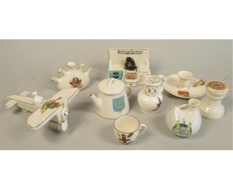 A Willow Art/Carltonware Coventry souvenir model of a WW1 aircraft, a Hull souvenir kitchen range together with seven other s