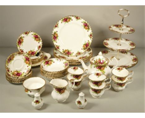 A Royal Albert 'Country Roses' tea/dinner service consisting of a teapot, six cups &amp; saucers, six side plates, six dinner