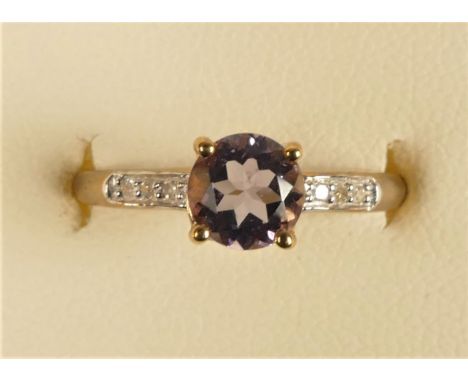 A 9ct gold amethyst and diamond ring, stated weight 0.03cts, L 1/2, 1.4gm 