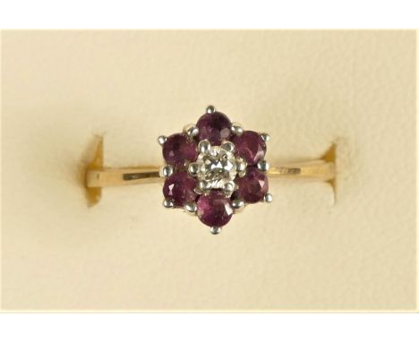 A 9ct gold ruby and diamond cluster ringK, 1.7gm 
