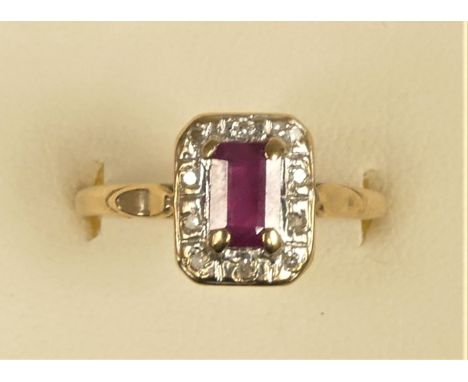 A 9ct gold ruby and diamond cluster ring, P, 1.9gm