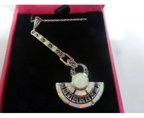 A silver, marcasite and opal set pendant necklace on a silver chain