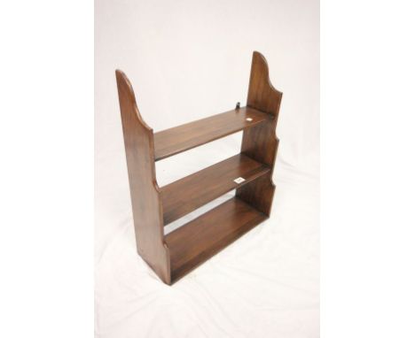  A mahogany three tier hanging wall shelf 